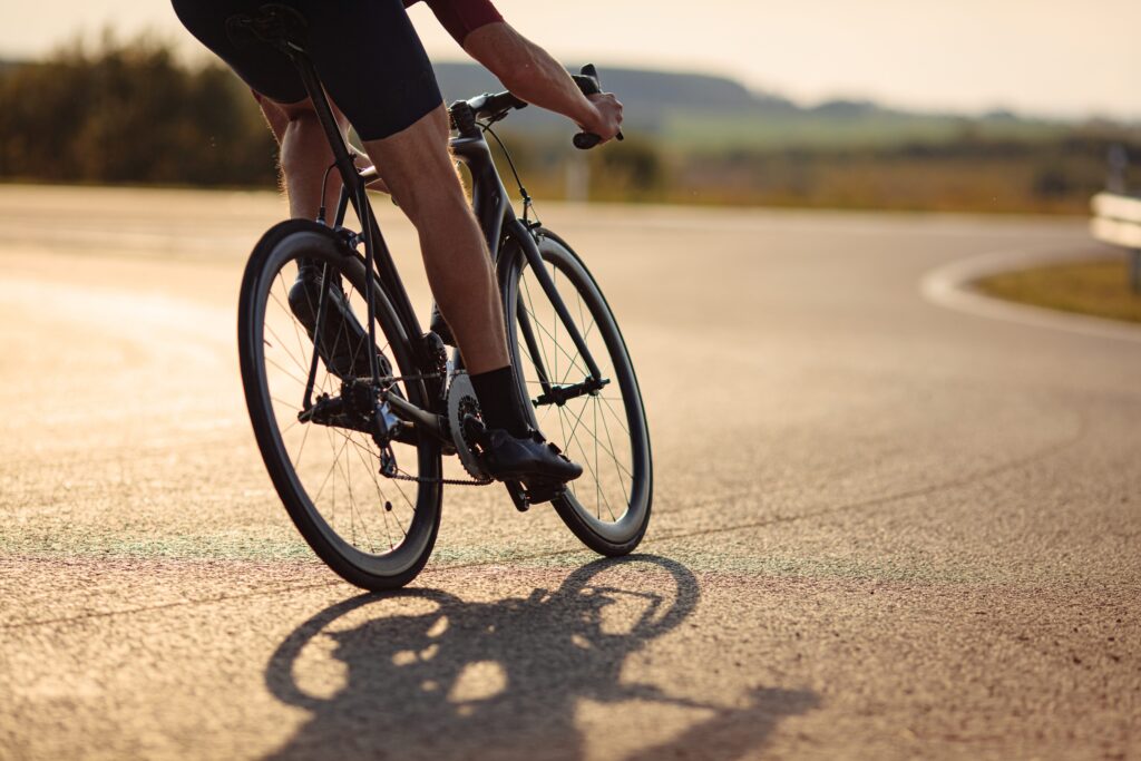 A cyclist rides downhill during an IRONMAN triathlon