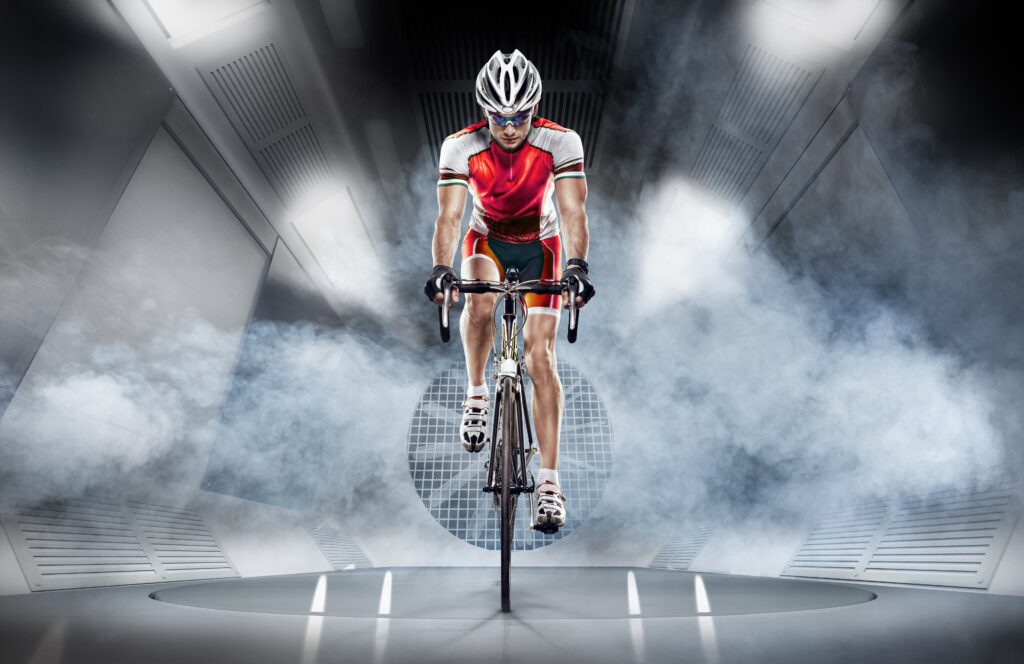 A cyclist in a wind tunnel testing their bike for aerodynamic efficiency 