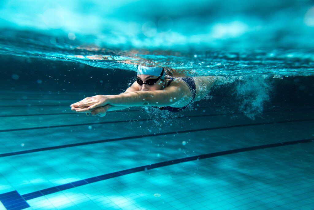 A beginner triathlete swimming in the pool